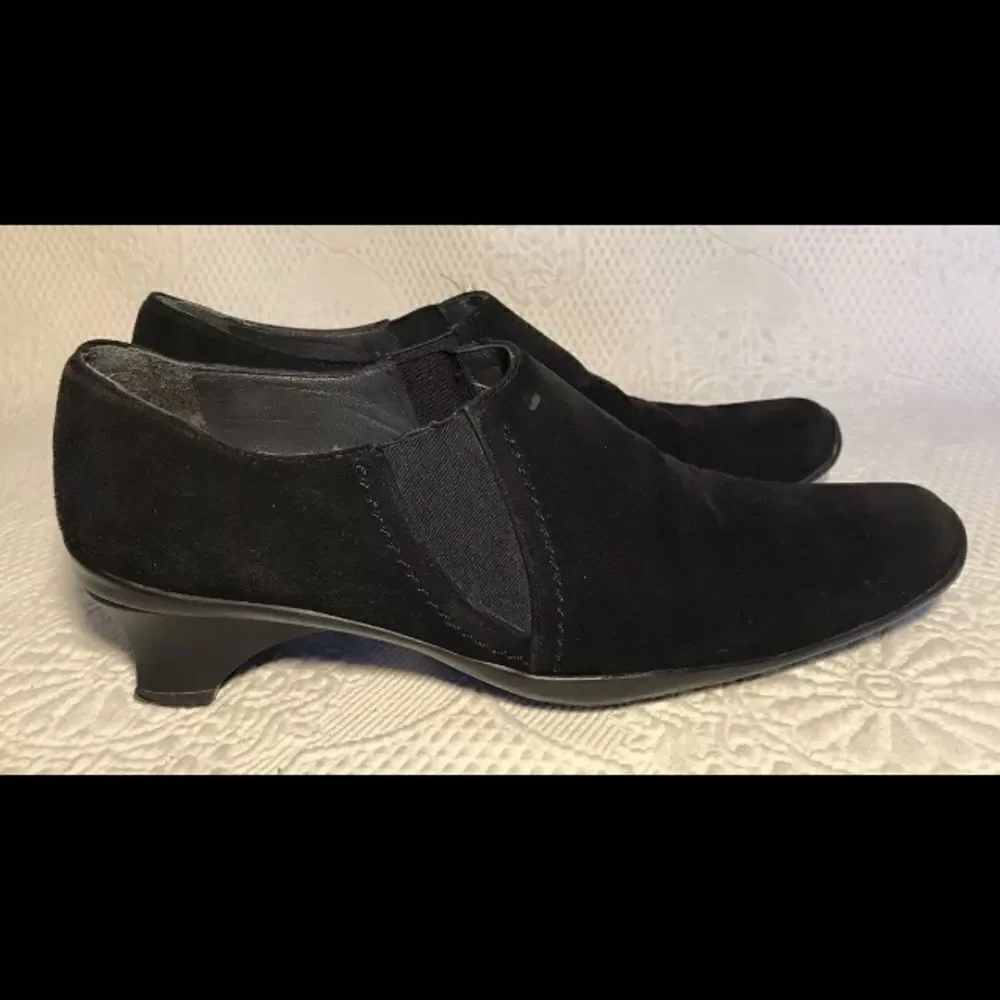 Stuart Weitzman black suede slip ons